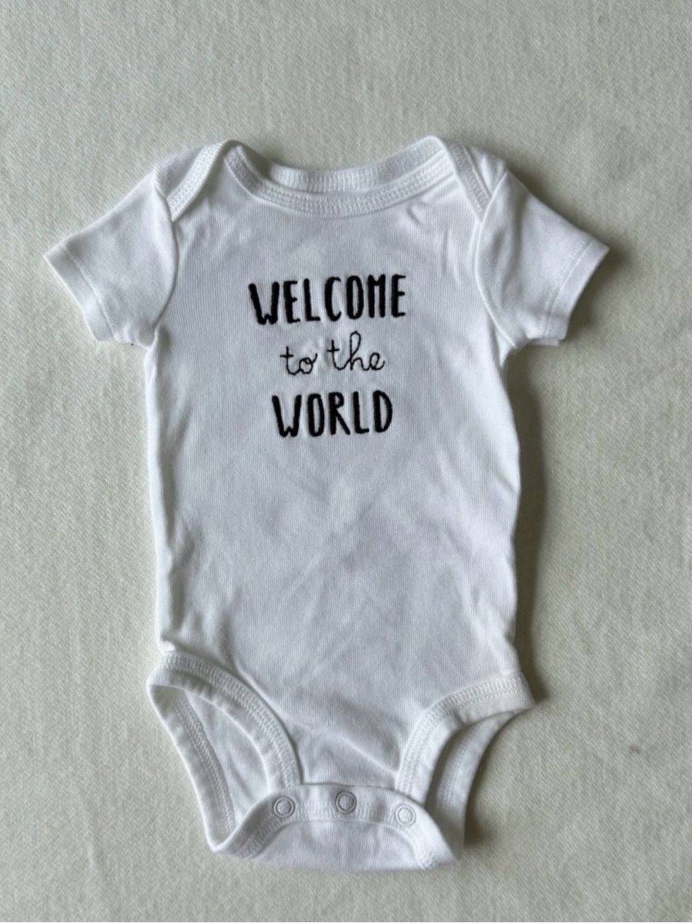 Carter's White Baby Onesie with Black 'Welcome' Script Newborn